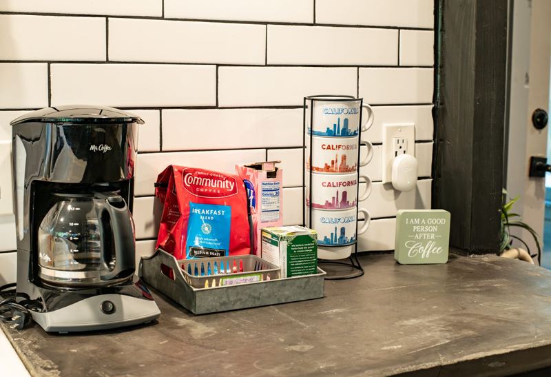 Coffee station with mugs and coffee supplies